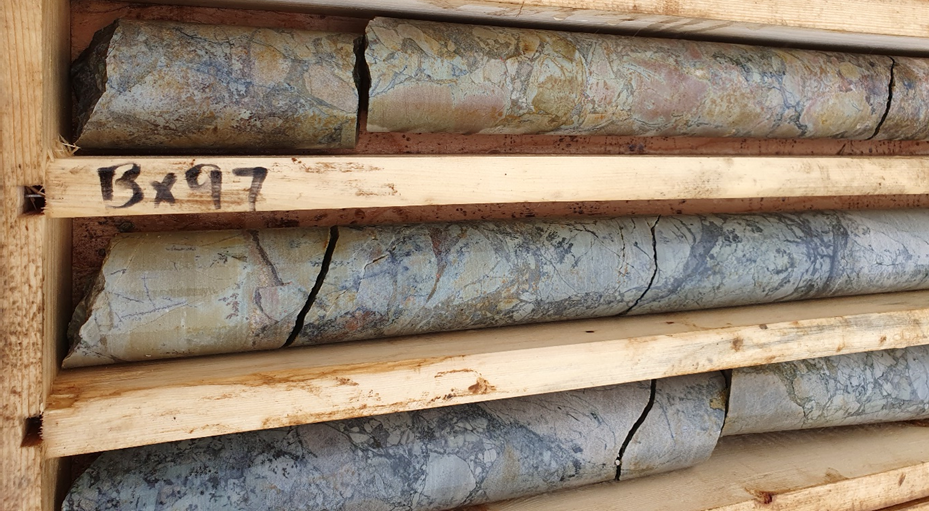 Figure 1: Drill core from ST24-01 from approximately 315.4 – 318m downhole. Dense veins and breccia of visible chalcocite (copper sulfide) can be seen as dark sooty grey, within light grey/tawny dolomite host rocks. This interval also contains blebs of native copper (metallic mineral, top right).