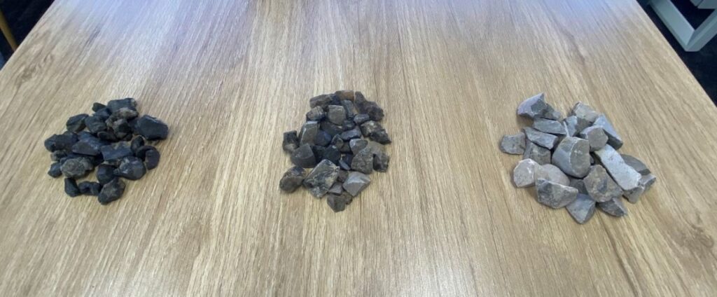 Figure 3: The three products produced from the ore sorting test work. Left to right - very high density product, intermediate product, and low density product (waste rock).