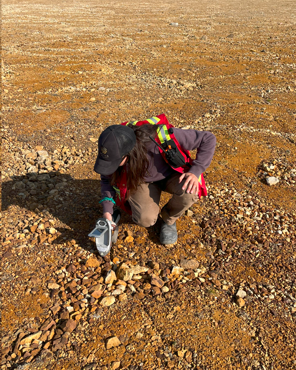 Figure 4: Testing base metal gossans (brown/rust-coloured rocks) at Tempest with a portable XRF prior to sampling for laboratory assay. Select samples have yielded assays of up to 38.2% Cu and 30.8% Zn.