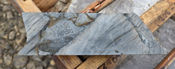 Figure 1: Dense crackle breccia with visual chalcopyrite rimming from drill hole ST25-04 (210.6-210.75m downhole).